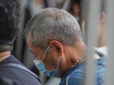 Older man wearing mask in Shanghai subway