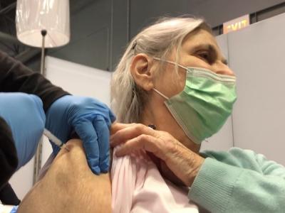 Older woman getting COVID shot