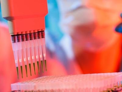 PCR test with scientist in background