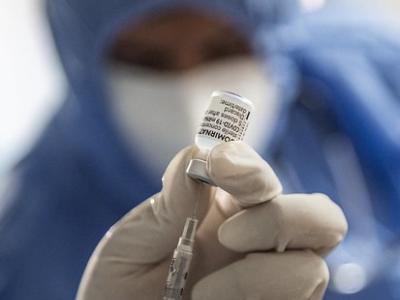 Pfizer COVID vaccine vial and syringe