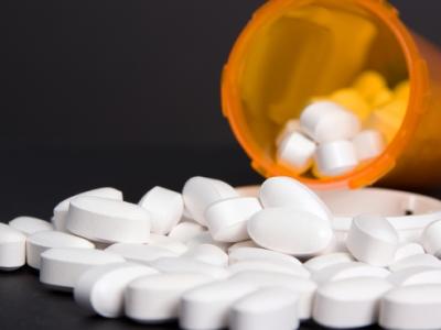 Pills spilling from bottle