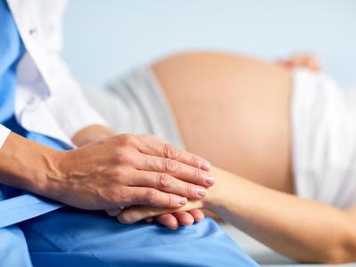 Pregnant woman and doctor