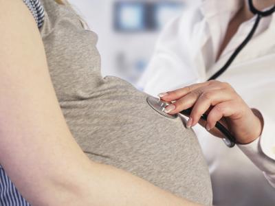 Pregnant woman with doctor