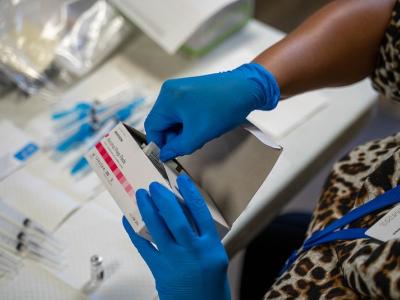 Vaccinator with wipes and syringes