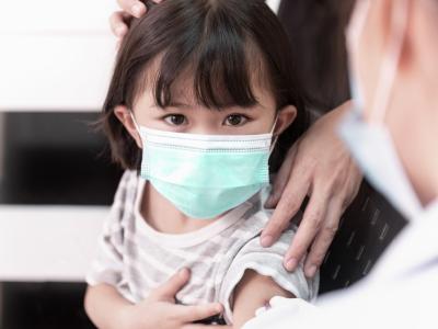 Preschool girl getting vaccinated