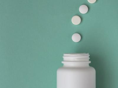 White pills in shape of question mark