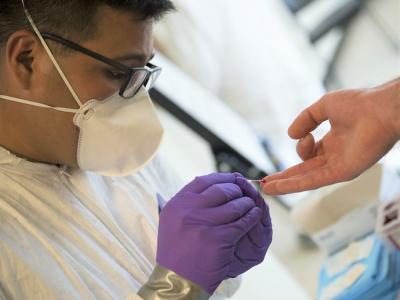 Finger prick for rapid COVID testing