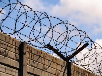 Razor wire on top of wall