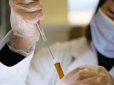 Researcher with COVID vaccine