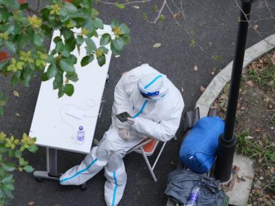 Health worker guarding building in Shanghai