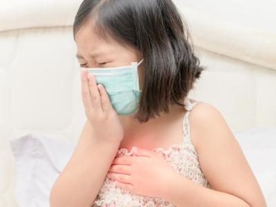 Sick Asian girl with medical mask
