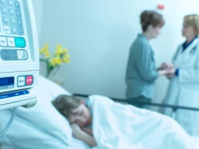 Sick child in hospital bed