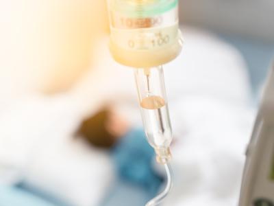 Sick child hooked up to IV fluids