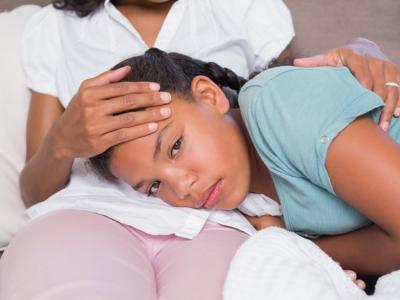 Sick daughter on mom's lap