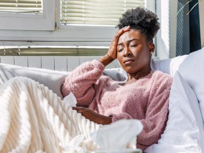 Sick woman on couch