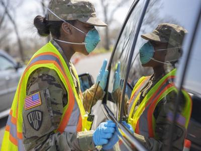 Soldier wearing N95 at car window