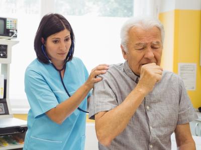Stethoscope exam on coughing patient