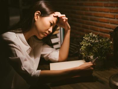 Stressed girl studying at home