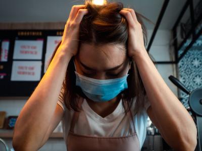 Stressed coffee shop worker