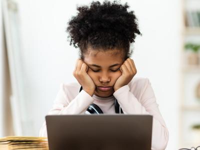 Stressed student at laptop