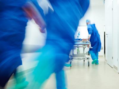 Surgeons rushing in hallway