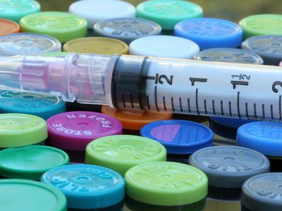 Syringe on vials