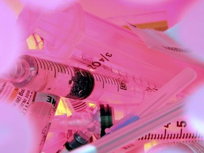 Syringes in sharps container