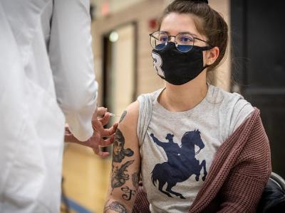 Teen getting COVID vaccine