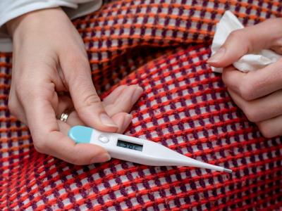 Thermometer on blanketed lap