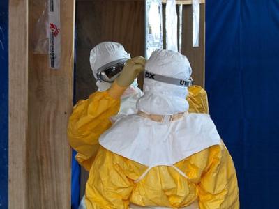 Two Ebola health workers wearing protective equipment