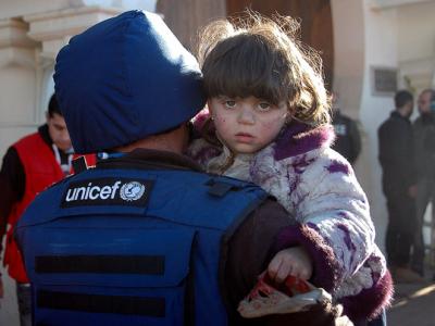 UNICEF worker and child
