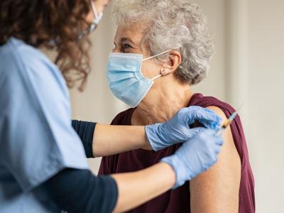 Older woman getting COVID vaccine