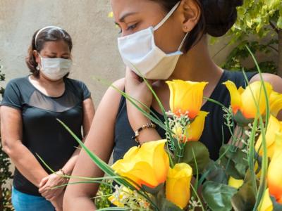 Wearing masks at funeral