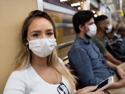 People wearing masks on a train