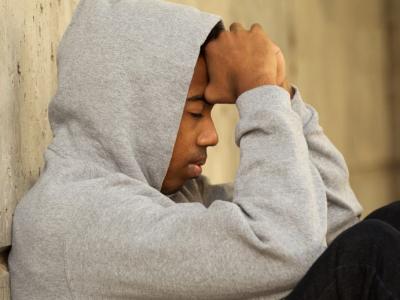 Weary young man wearing hoodie