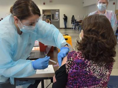 Woman getting COVID vaccine