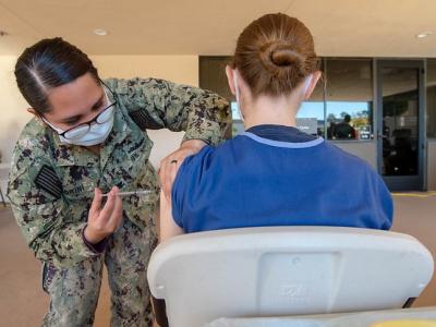 woman getting COVID vax