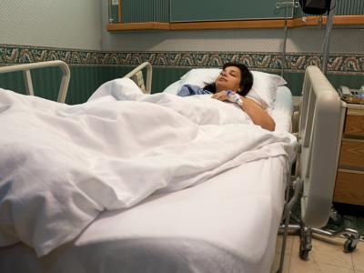 Woman in hospital bed