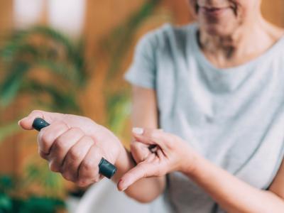 Woman monitoring her blood glucose