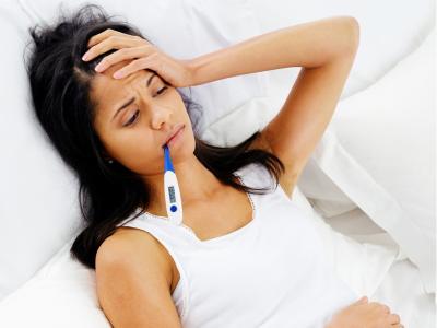 Woman sick in bed