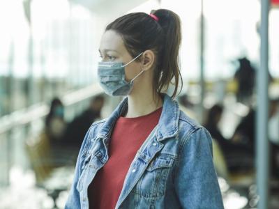 Woman wearing mask in airport