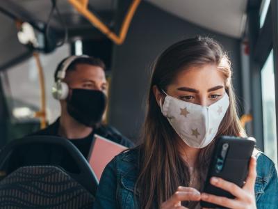 Woman wearing mask on bus