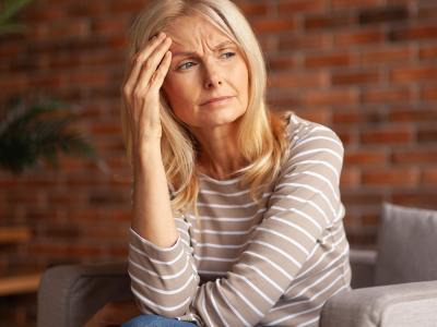 Woman with headache and brain fog