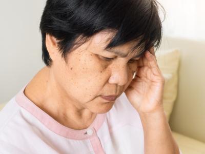 Woman with delirium or headache