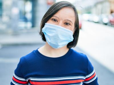 Woman with Down syndrome wearing mask