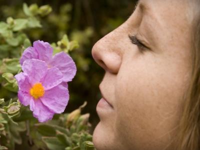 Woman smelling a flower
