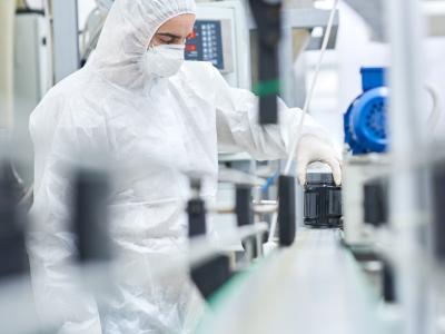 Worker on drug production line