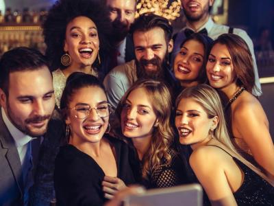 Young adult selfie at bar