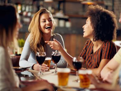 Young adults dining indoors without masks