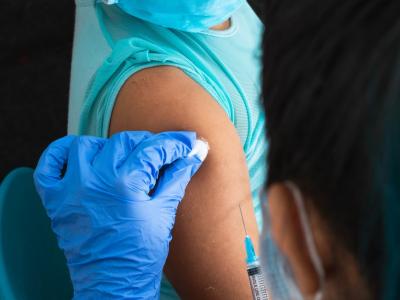 Young girl getting shot in arm